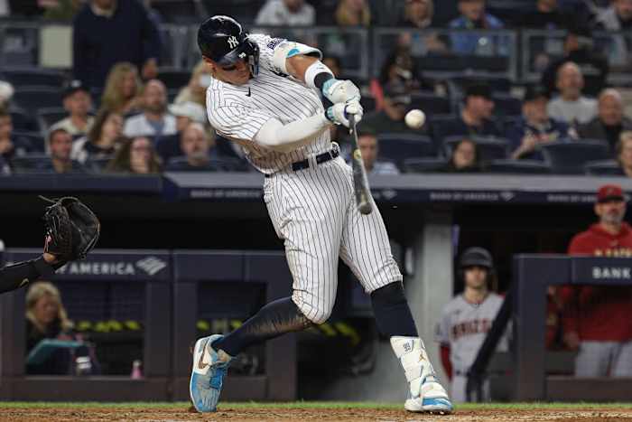 New York Yankees right fielder Aaron Judge (99) hits his third home run of the game during the seventh inning against the Arizona Diamondbacks at Yankee Stadium.